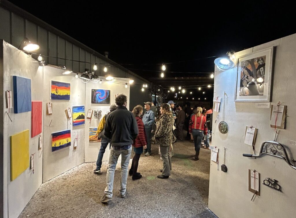 people outside at the art auction